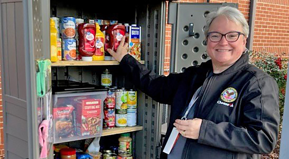 Woman at food cabinet