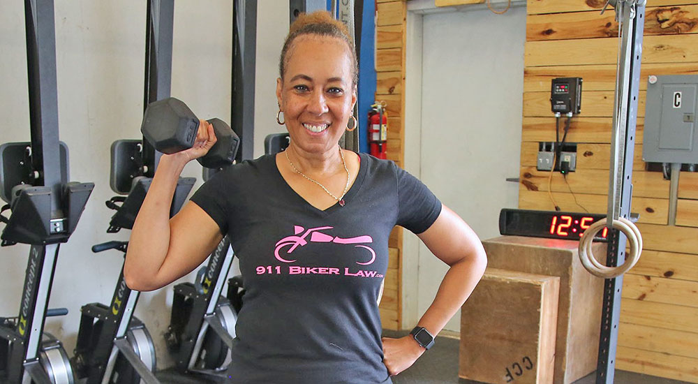 Female Veteran with barbell; Sports4Vets Throwdown