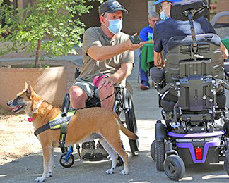 Man in wheelchair and his service dog