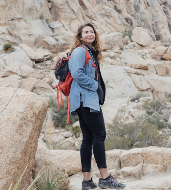 Woman hiking on a rocky mountain