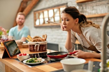 Woman frustrated with kitchen tasks