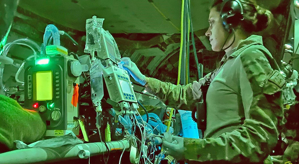 Nurse with medical monitors while in flight; Distinguished Flying Cross