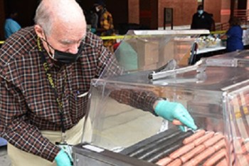 VA volunteer prepared hot dogs for Veterans