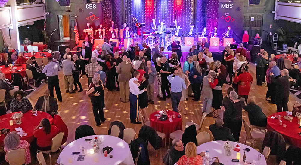 Large ballroom with many dancers; Salute to Veteran Patients