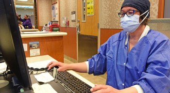 VA nurse entering data in computer