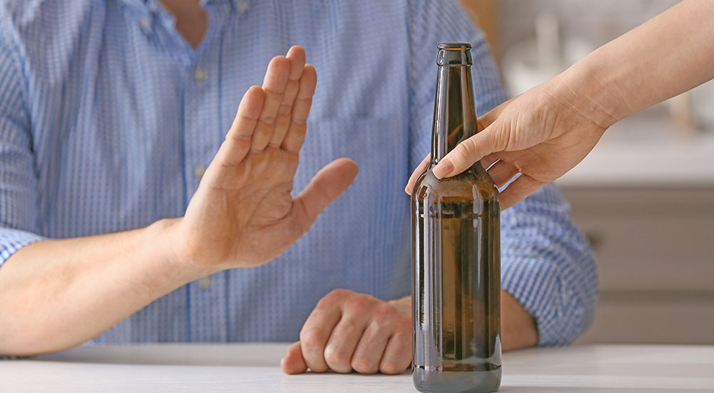 Man gestures no to alcohol