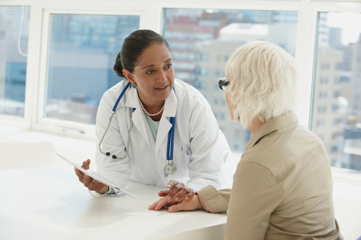 woman speaking to her health care clinician