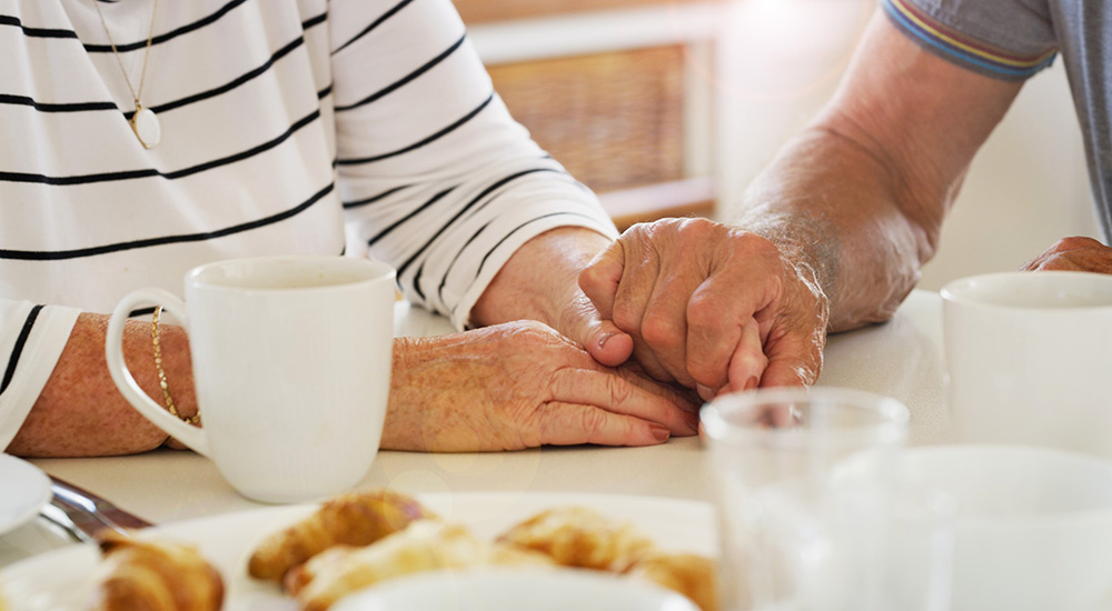 Geriatric specialist holds Veteran’s hands