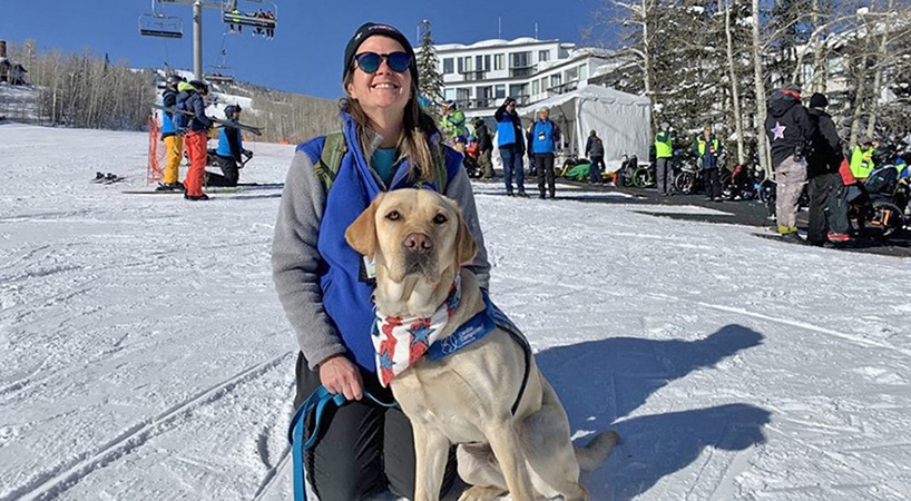 Facility dog with handler at Winter Clinic