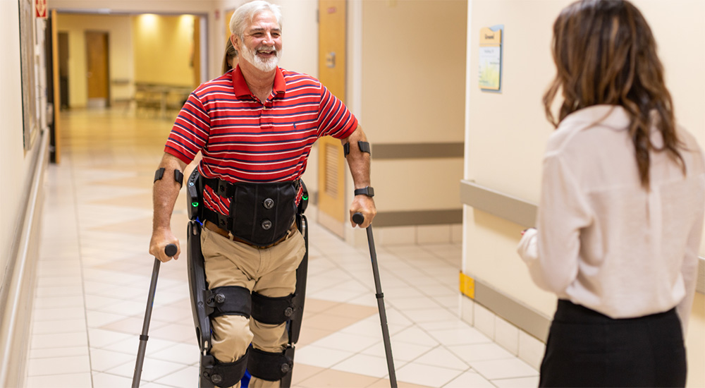 Man wearing exoskeleton walks