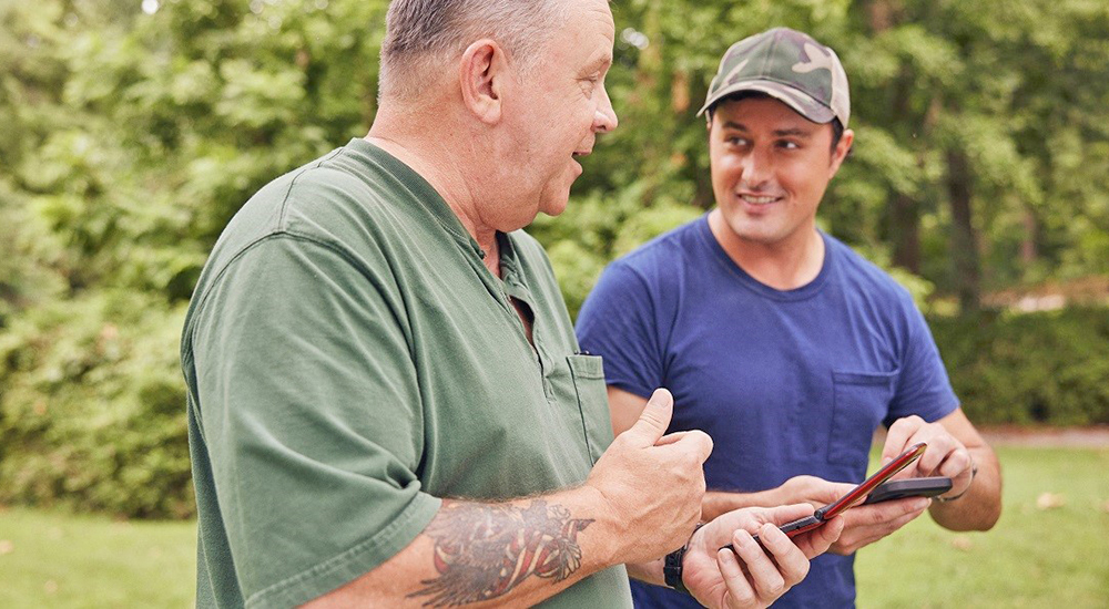 Veteran and son using telehealth