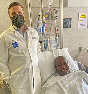 Doctor and patient after multi-organ transplant surgery