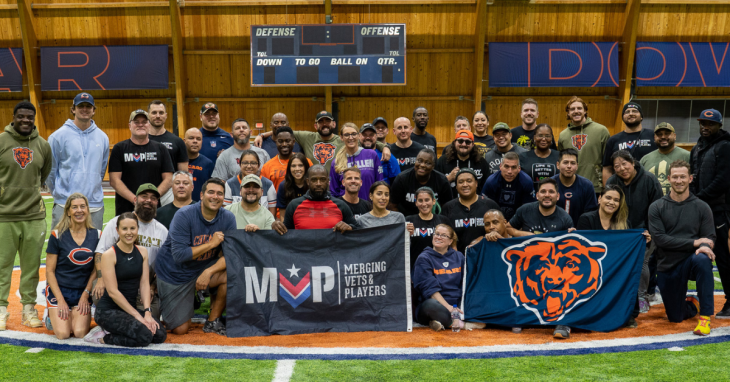 group photo of athletes and veterans from the peer support program Merging Vets and Players