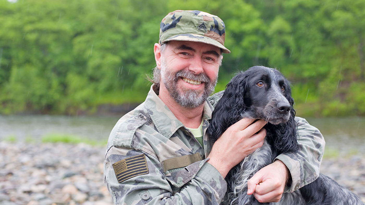 Veteran with dog in Pet Partners program