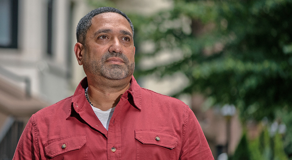 Veteran wearing red shirt in crisis