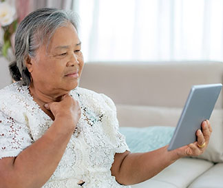 Veteran patient uses tablet for Telehealth