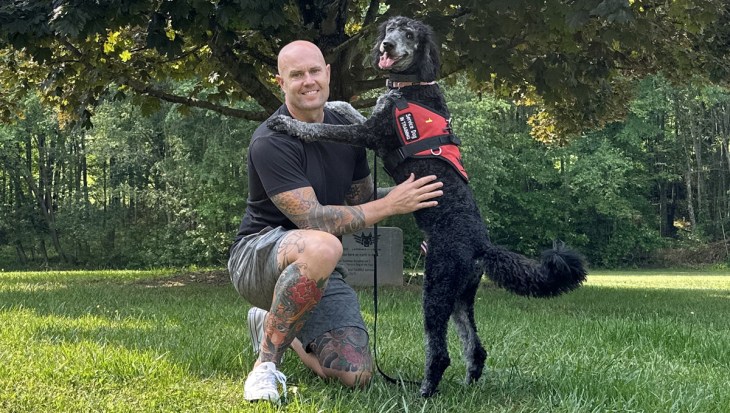 Leashes of Valor photo: Adam Faine with his service dog, Rosi, which he received at no cost from Leashes of Valor. Adam spent 22 years in the Army and deployed to Iraq and Afghanistan multiple times. "There is nothing out there that is as comforting or that can do the things a service dog can do."