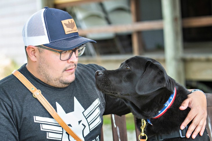 Leashes of Valor photo: Alan served in the Army for seven years, including a year spent in Iraq. He received his service dog, McGee, to help with symptoms of post-traumatic stress and migraines.