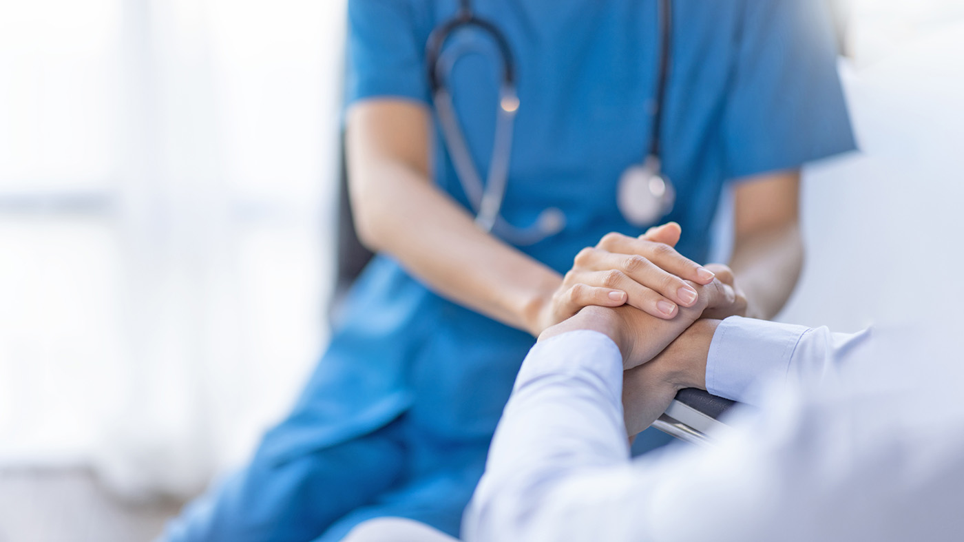 Hospice nurse with patient