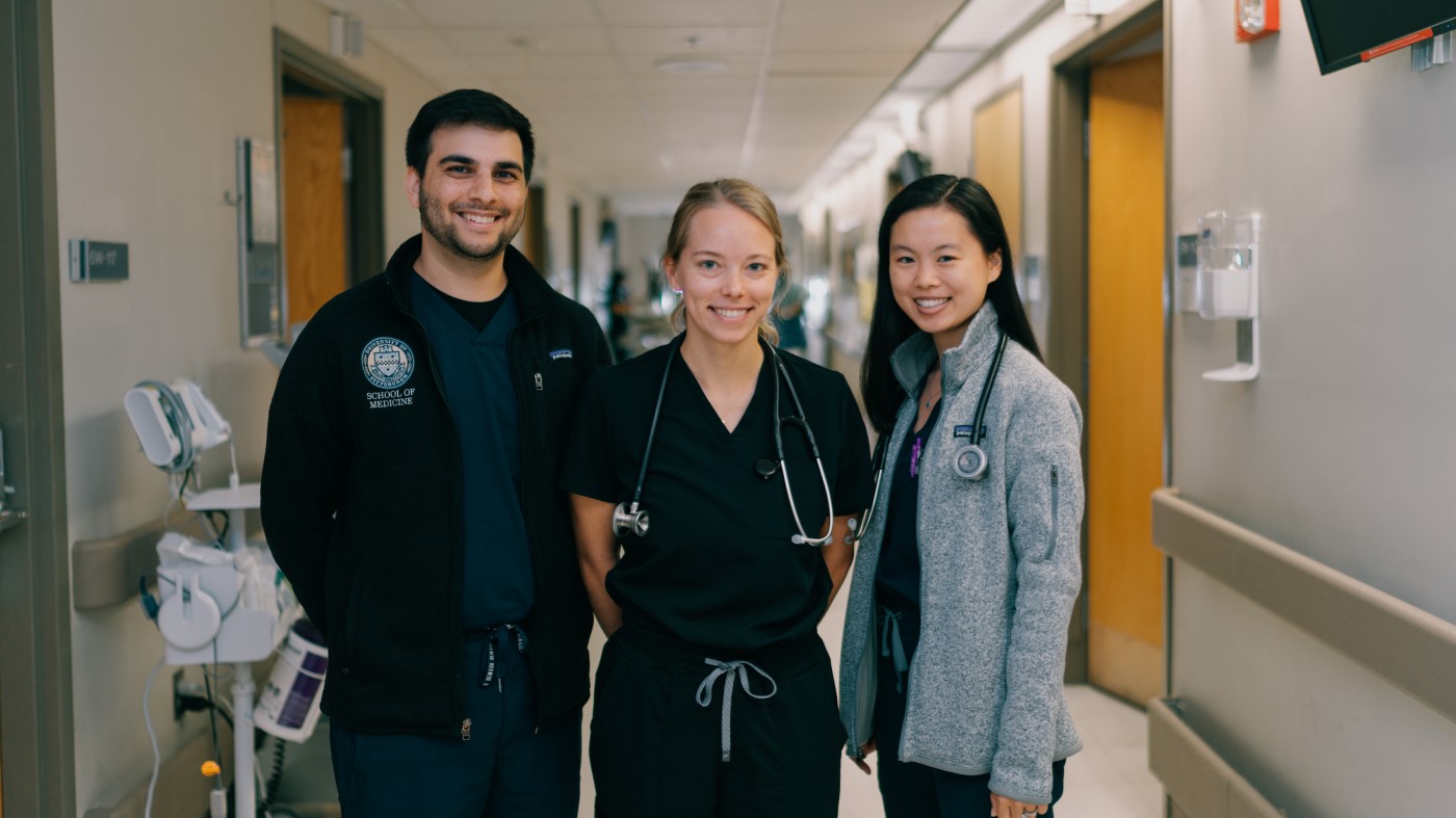 Thanksgiving at VA means serving Veterans, just like these 3 clinical staff members standing in a hallway inside one of our facilities.