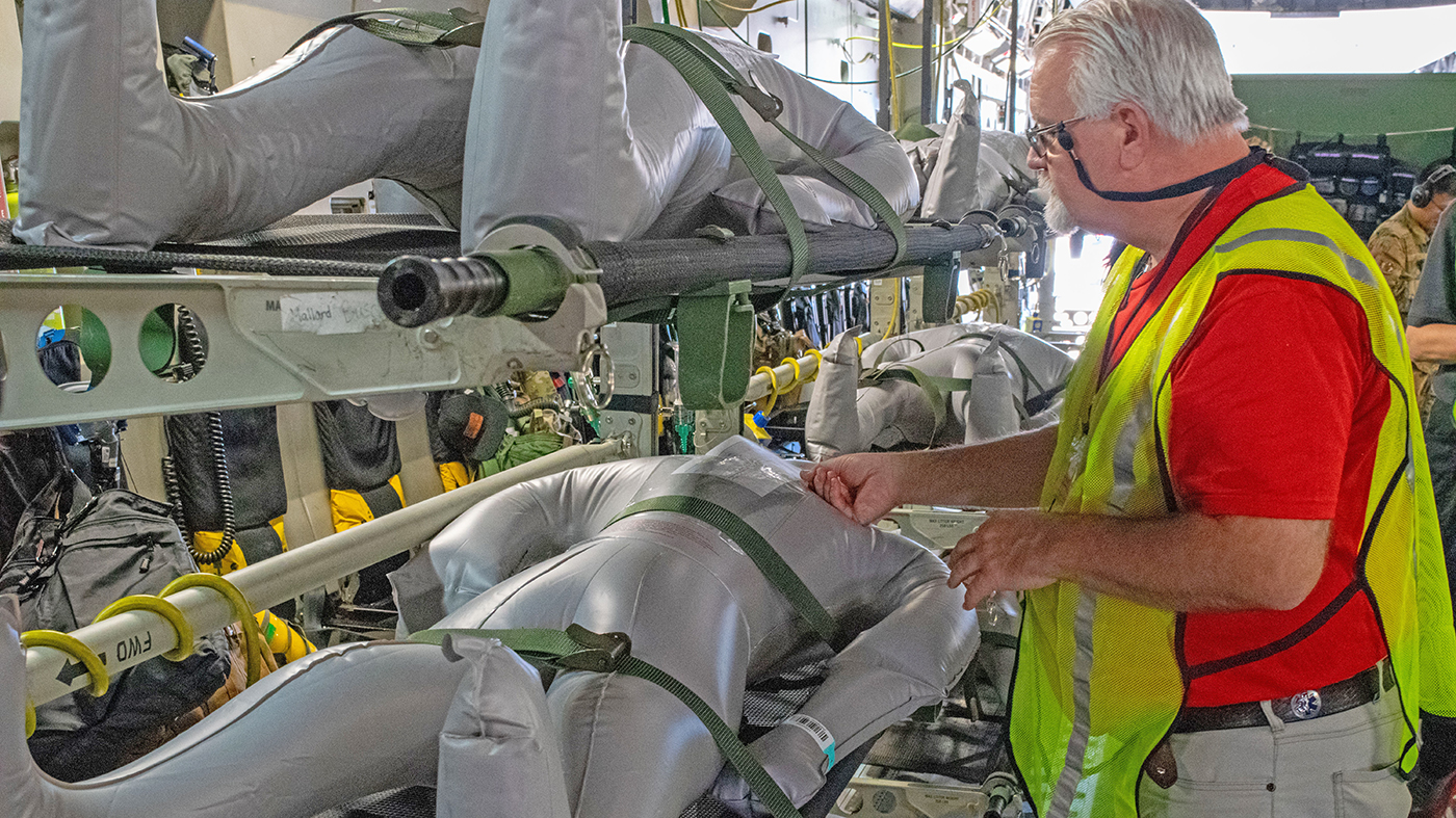 Man with mannikin in hurricane exercise