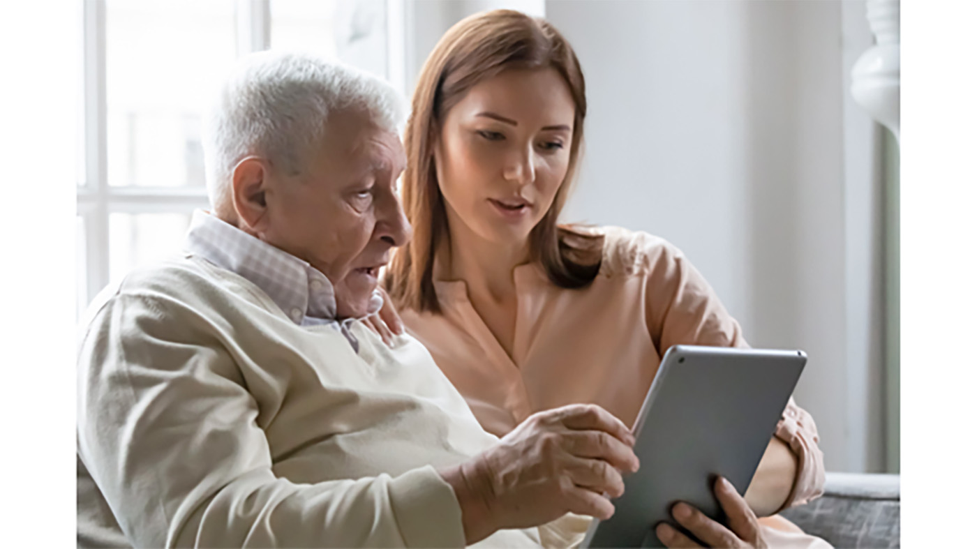 Veteran and caregiver reviewing information with Video Connect