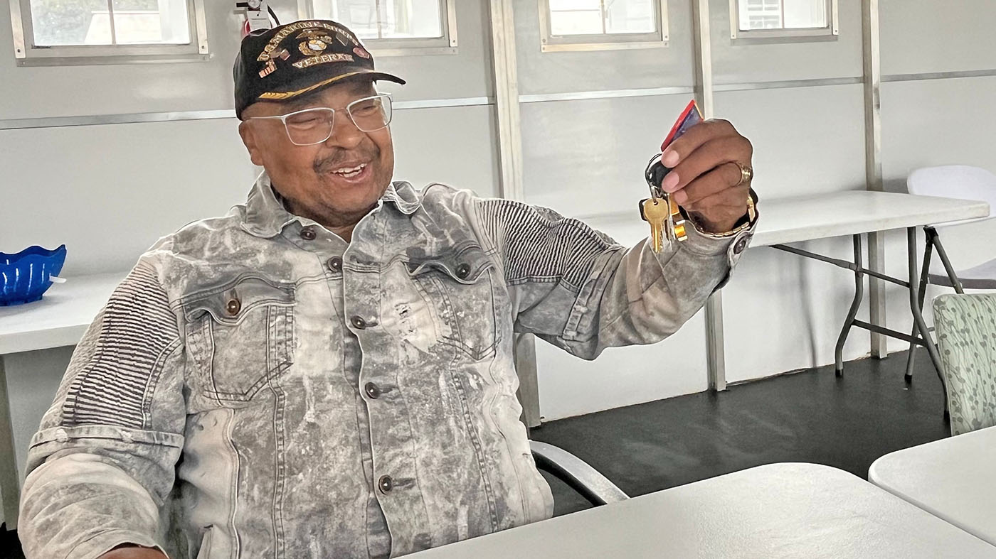 Homeless Veteran with keys to new apartment