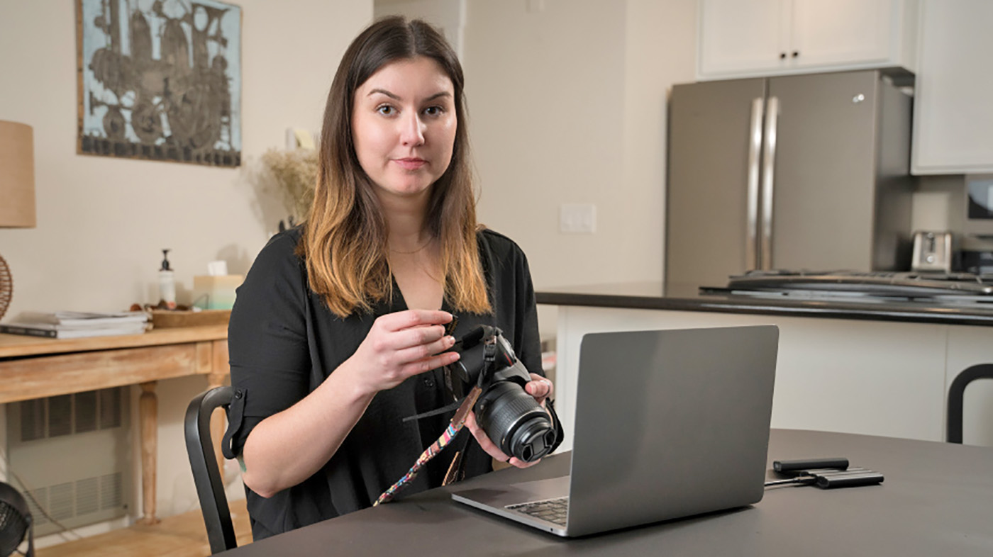 Woman with laptop and camera; suicide prevention