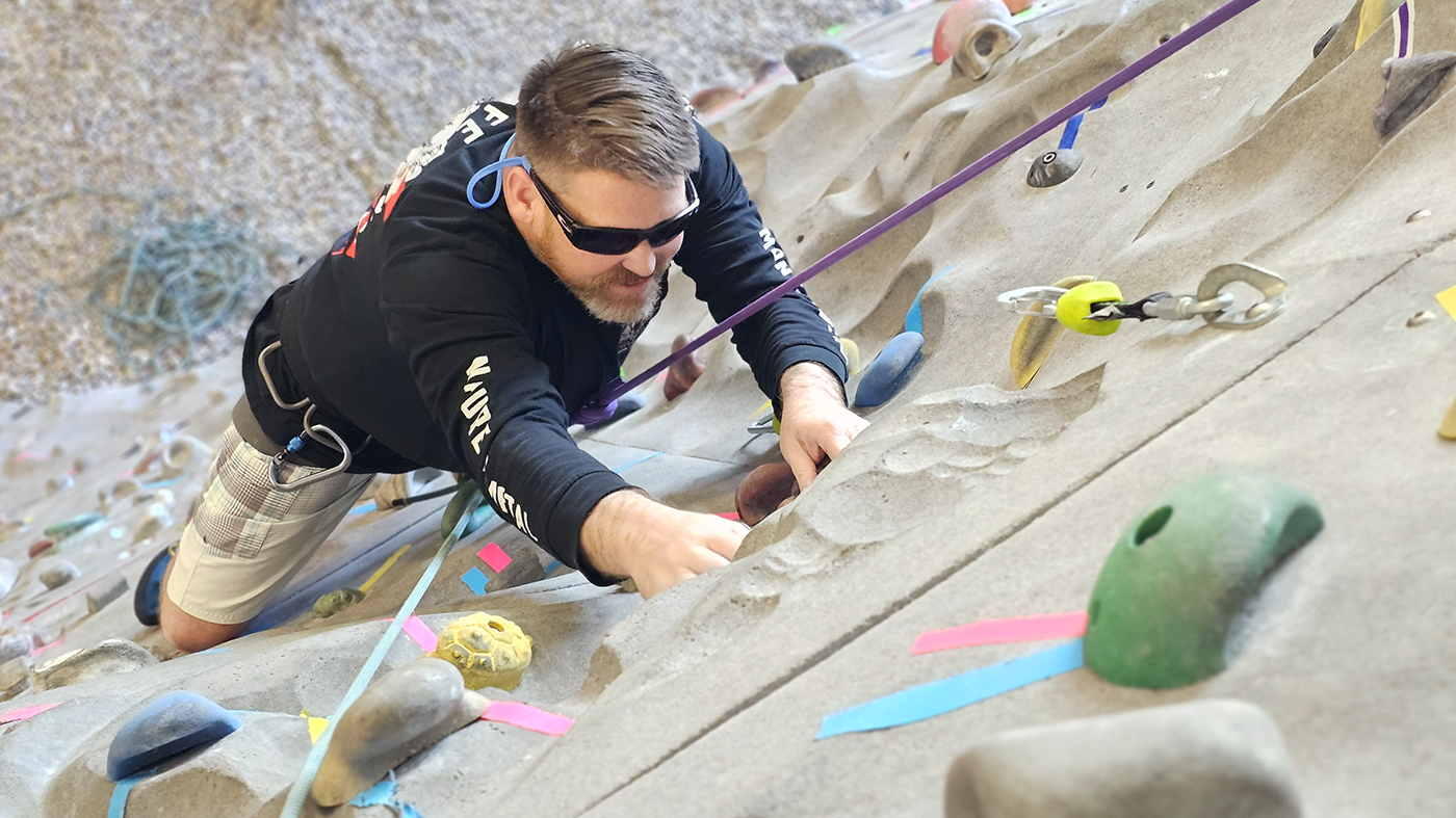 Man climbing rock wall