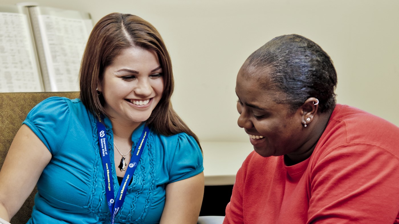 A VA social worker engages in discussion with a Veteran.