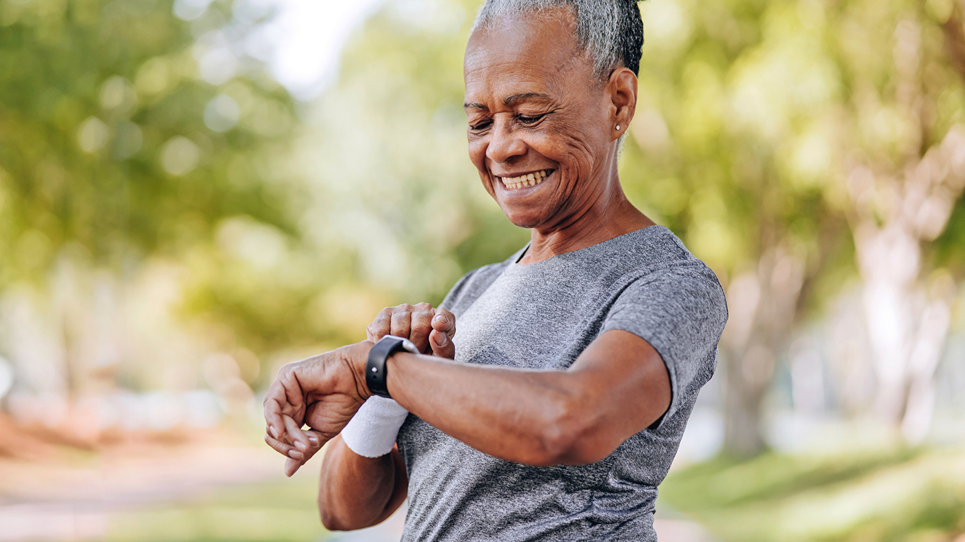 Woman with smart watch; heat safety active