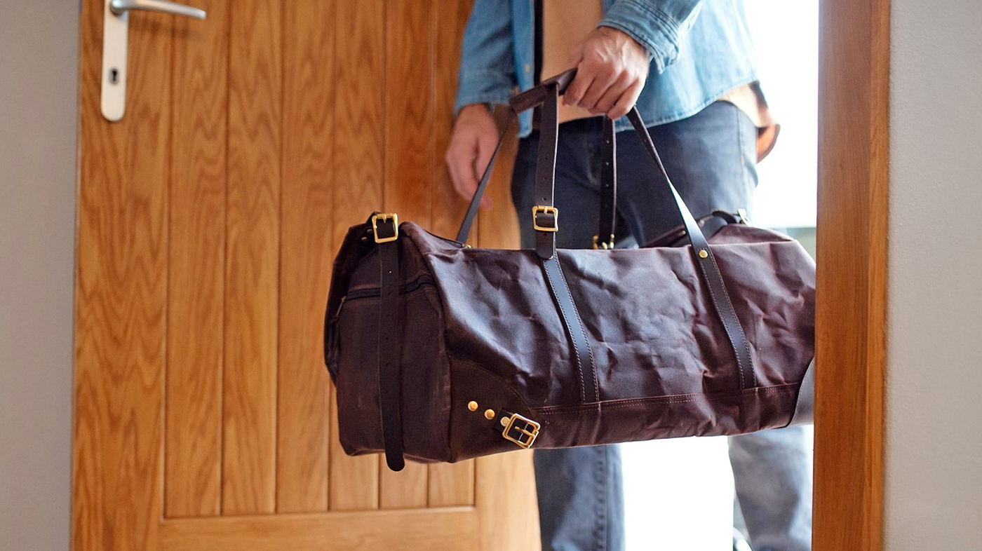 Man with duffel bag; HEARTH military transition