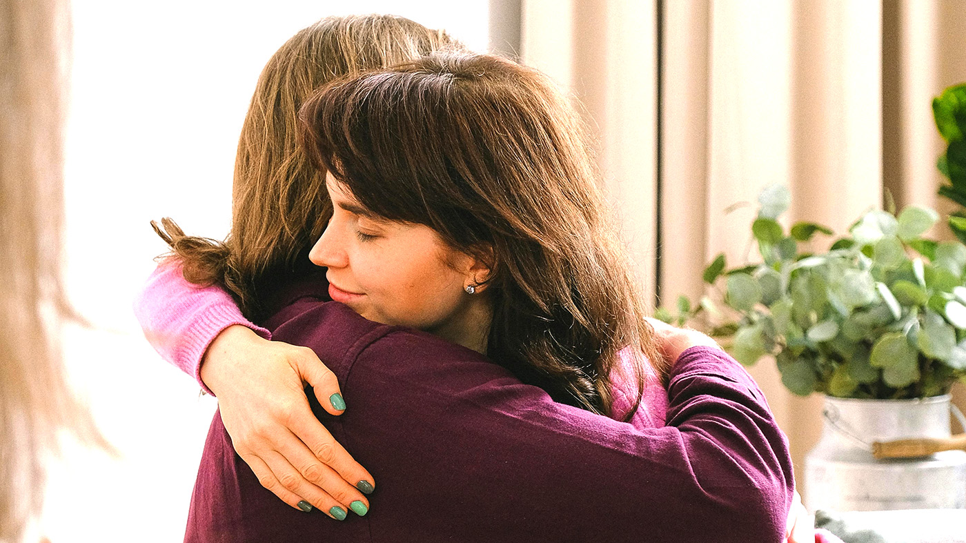 Women hugging; overdose awareness