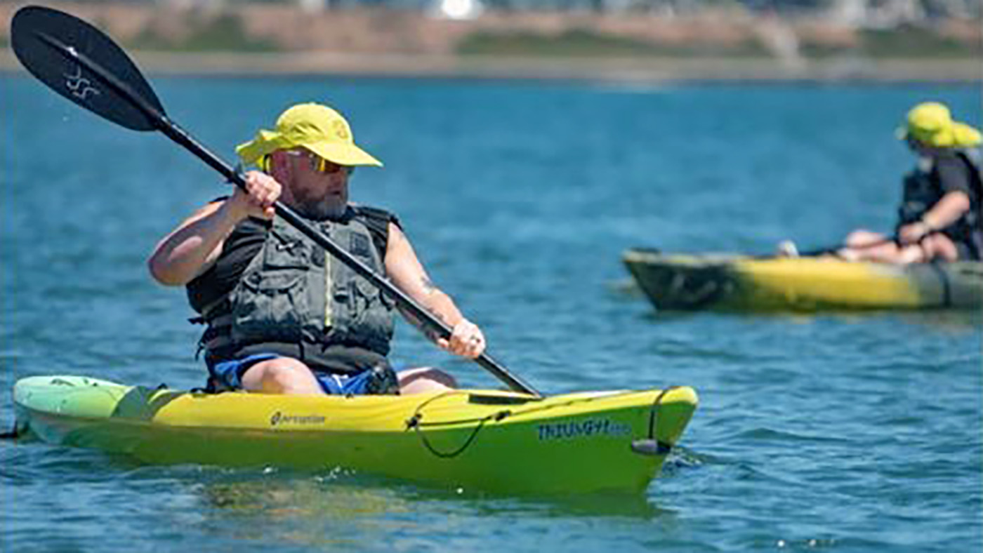 Vet in kayak; summer sports clinic