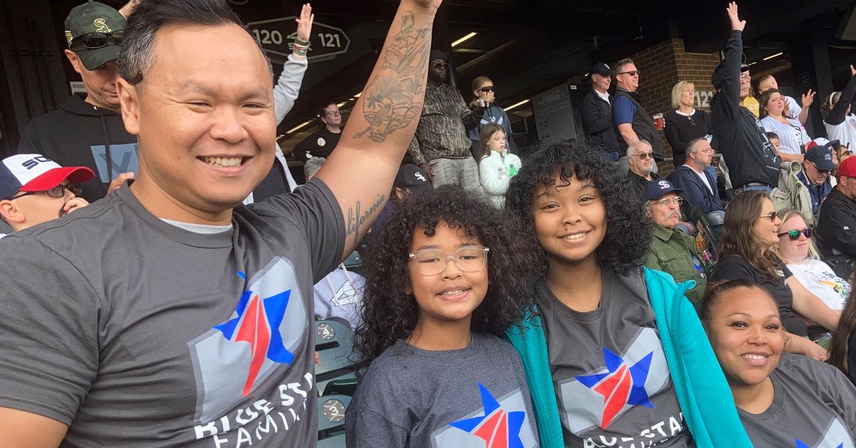 Family wearing Blue Star Welcome Week t-shirts.