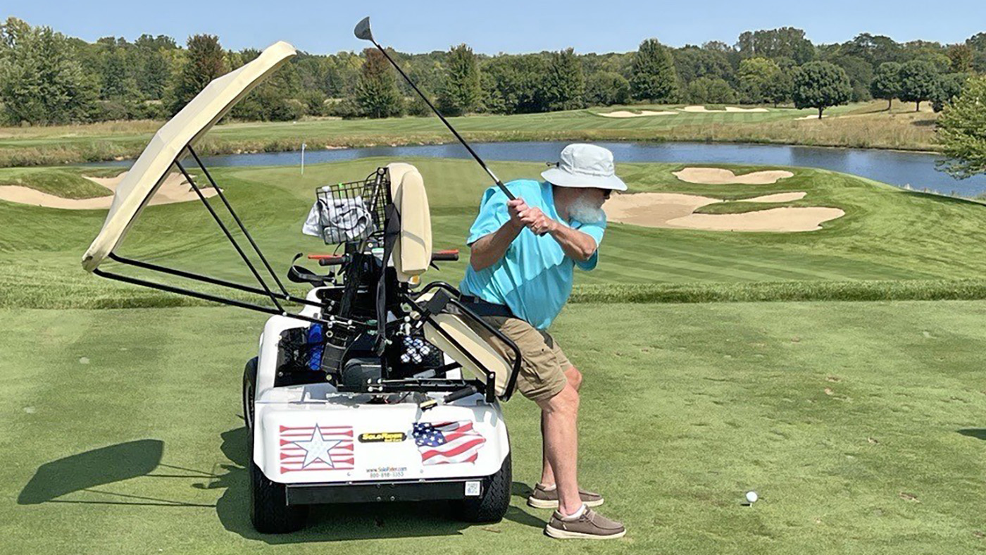 Veteran teeing up on golf course