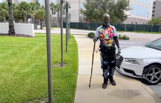 A man walking in an exoskeleton at the Autonomous Caregivers Robotic Demonstrations