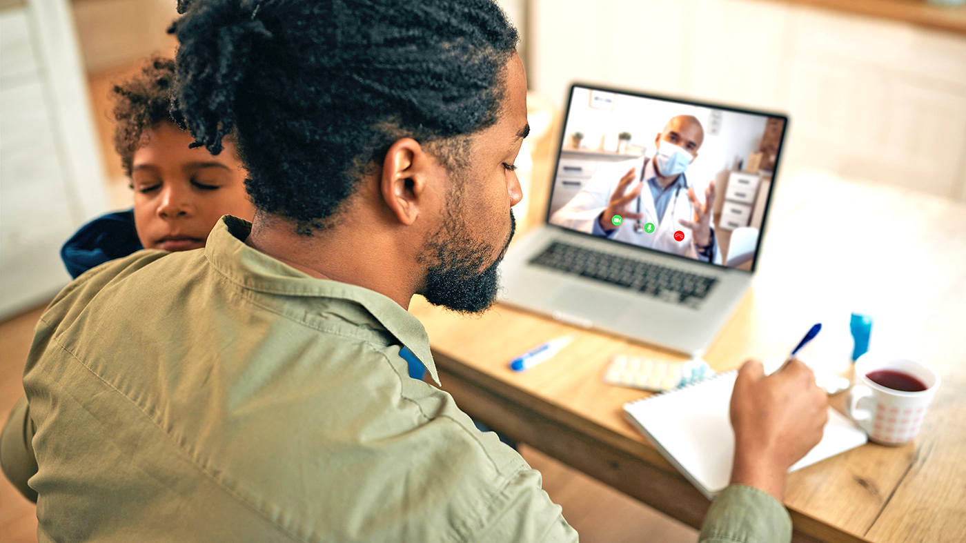 Man at computer; VA Health Connect