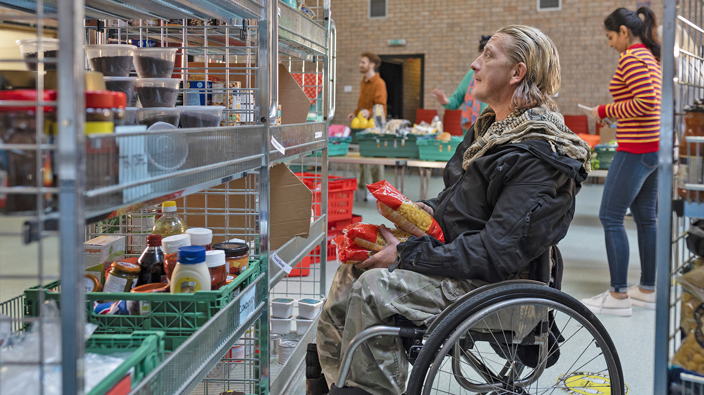 Man at food pantry; serving hope