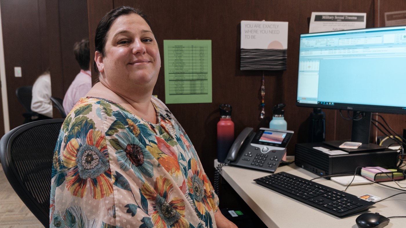 A VA medical support assistant at her desk.