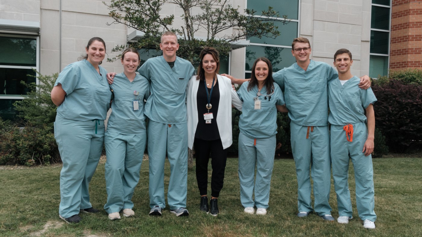 A group of happy VA employees, with arms linked, showcasing our positive workplace culture., which helped them end their job search.